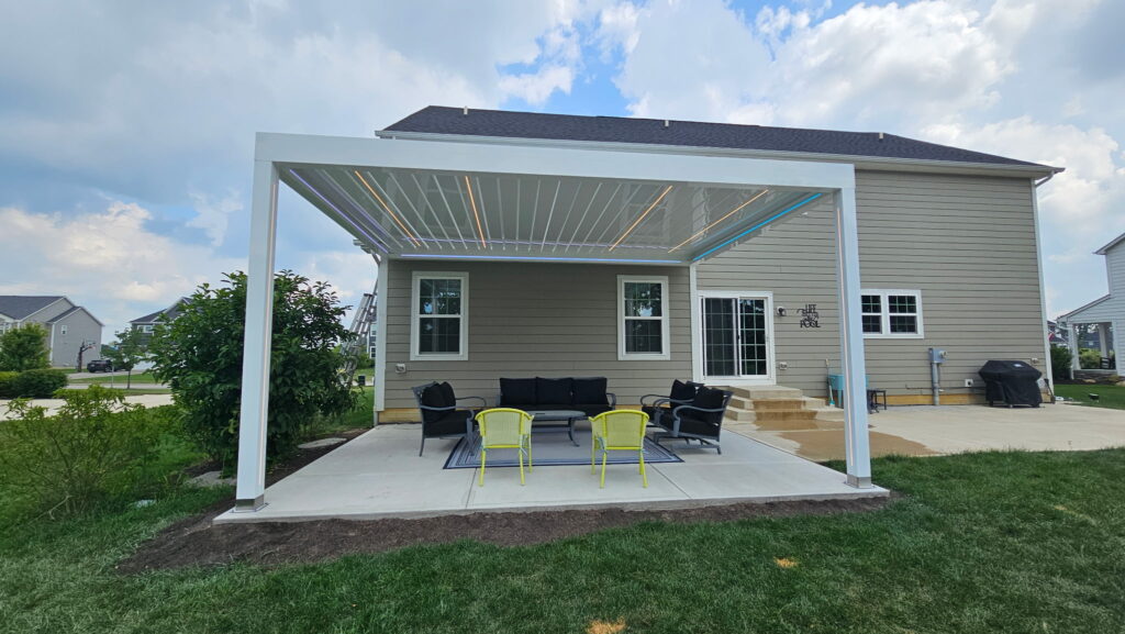 Residential patio with retractable awning providing shade for outdoor seating.