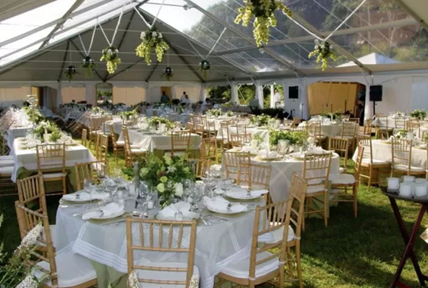 Weatherproof outdoor event tents from Anchor Industries protecting guests, equipment, and food from rain.”