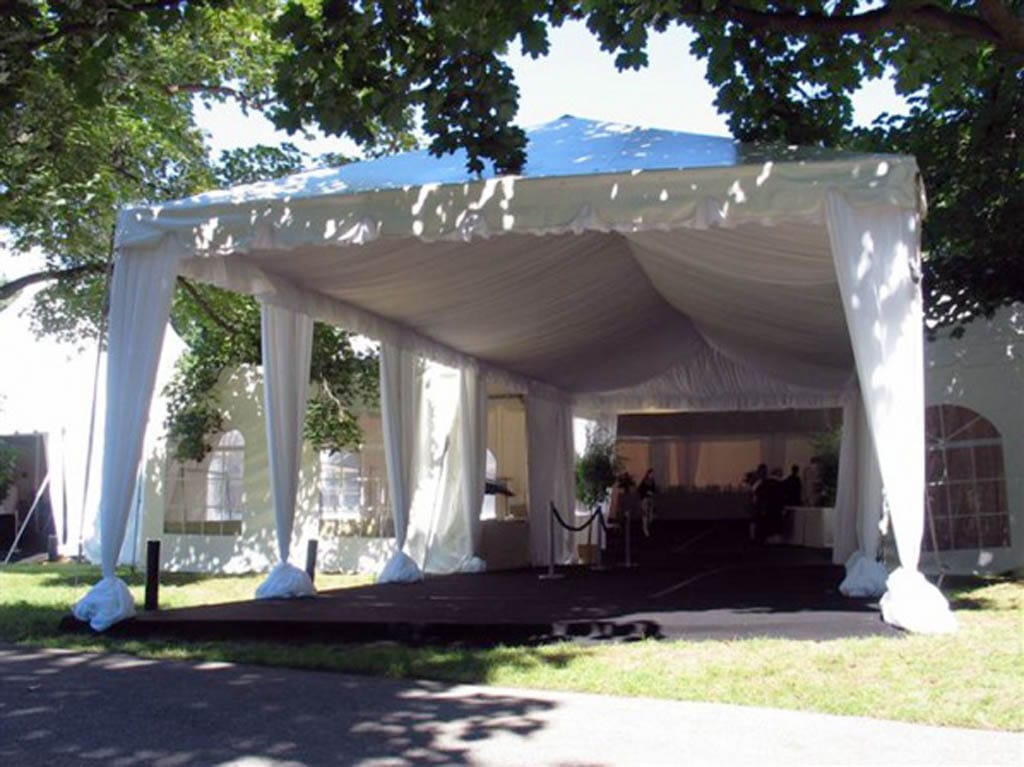 Luxurious entrance tent with a draped canopy, creating a grand entryway for high-end events and outdoor venues.