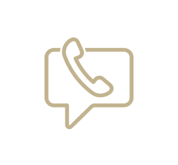 Gold outline icon of a phone inside a chat bubble.