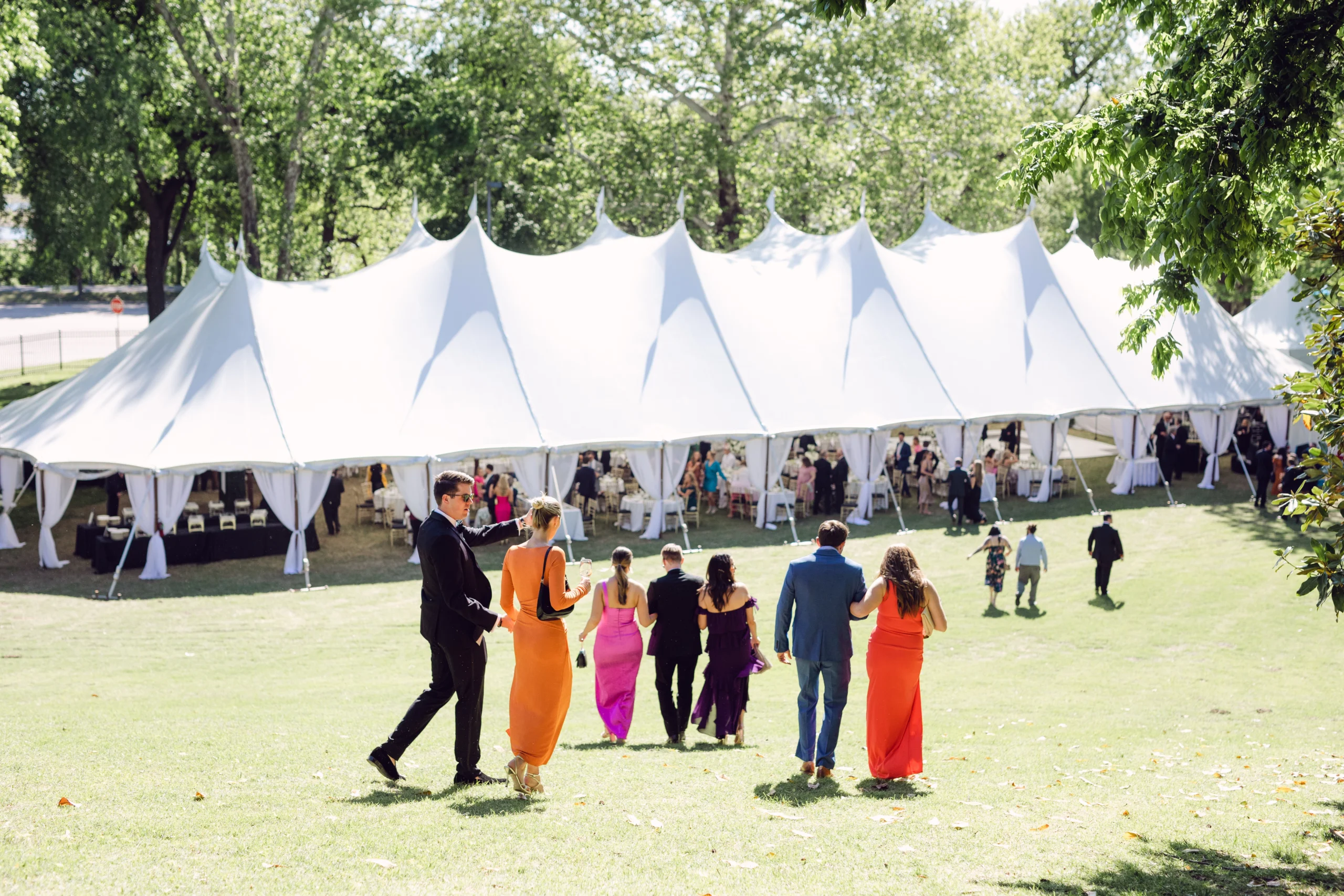 Anchor Industries white high peak pole tent at outdoor wedding reception