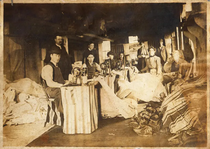 Anchor-History - Sepia-toned vintage photograph of people working at a Anchor.