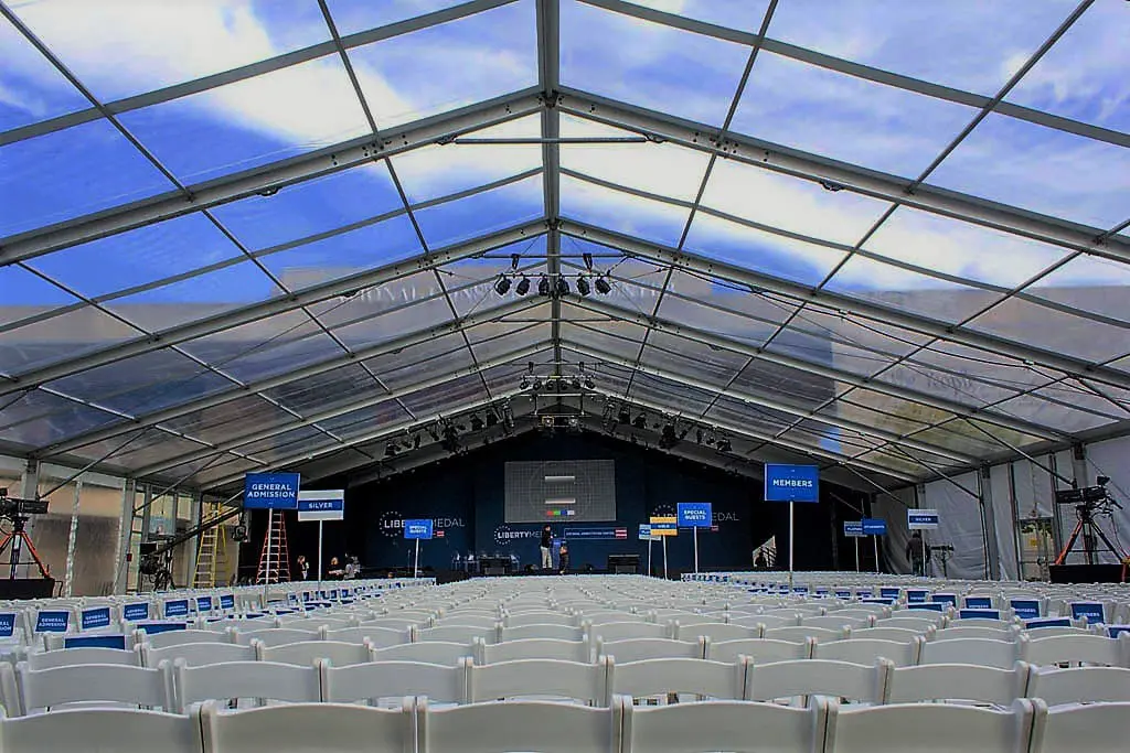 Transparent roof clearspan structure set up for indoor conference seating