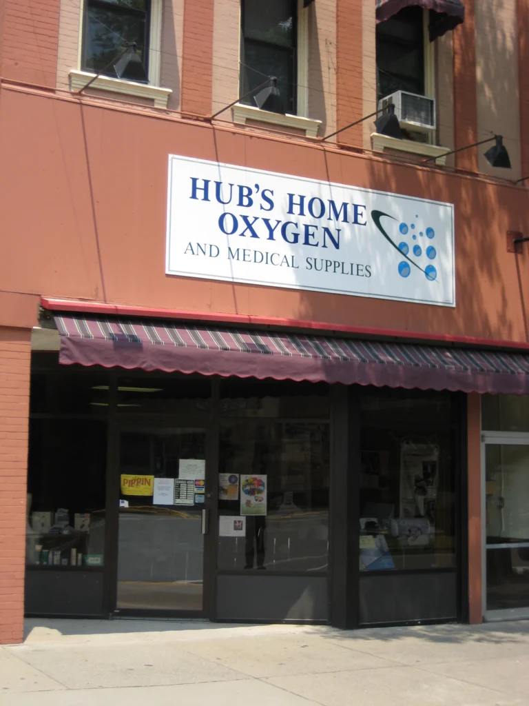 Storefront awning with business signage Anchor Industries