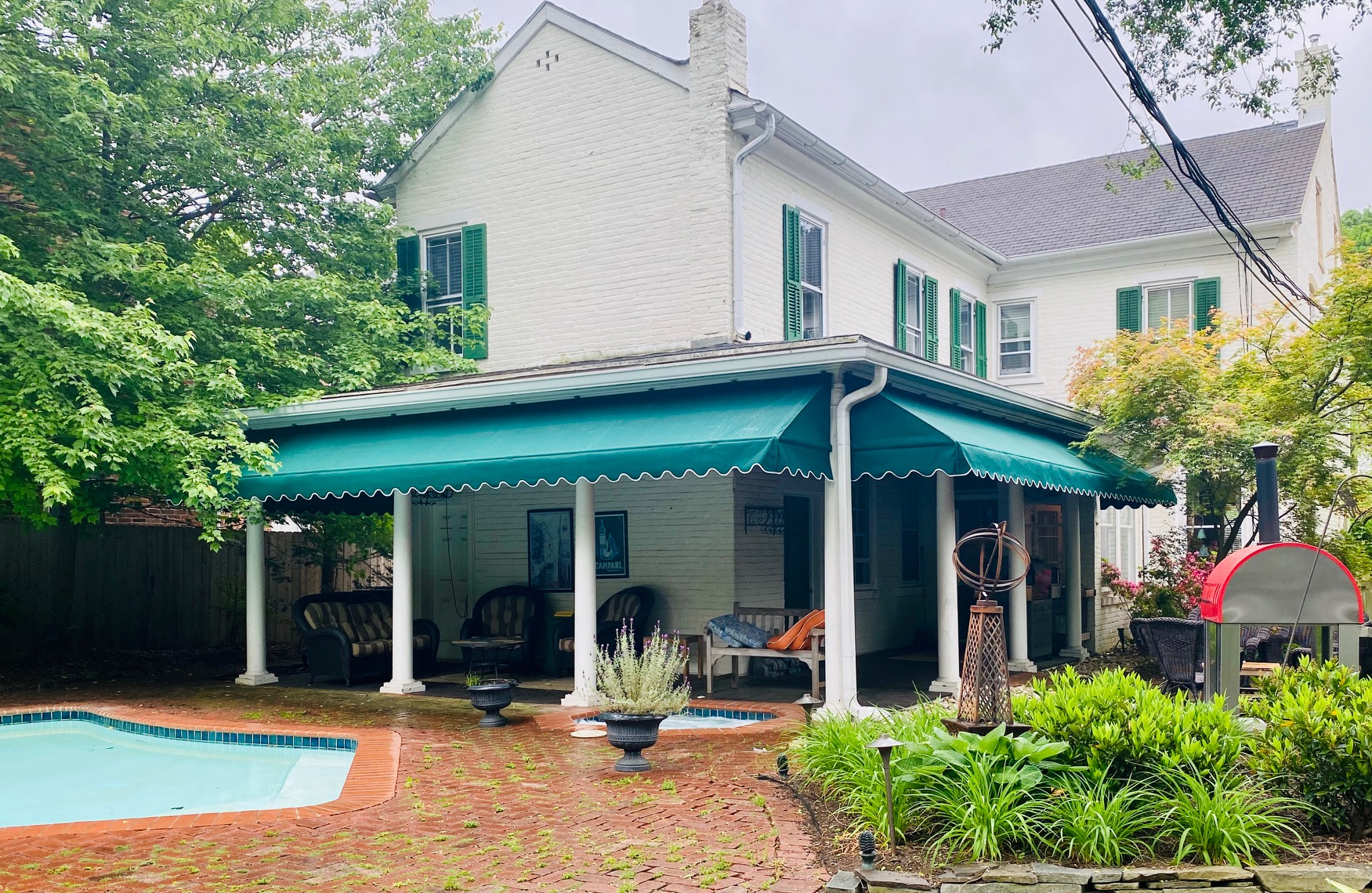 Green residential patio awning by Anchor Industries