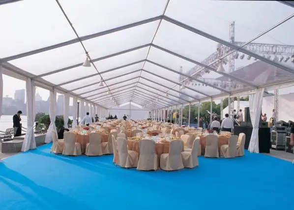 White frame clear span tent with blue flooring Anchor Industries