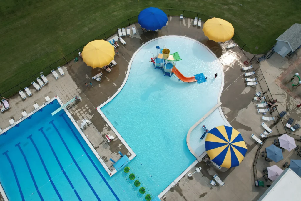 Anchor Industries poolside yellow and blue umbrellas at resort