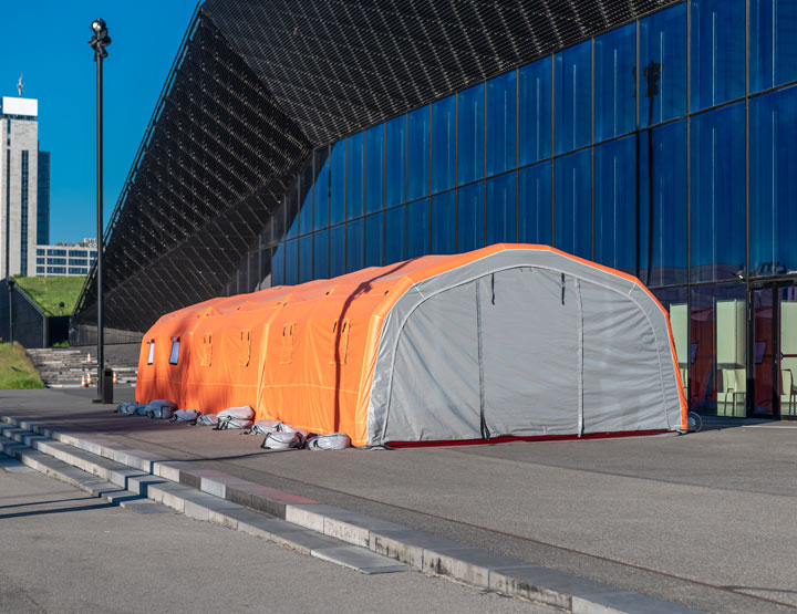 Anchor Industries orange fabric shelter at commercial facility