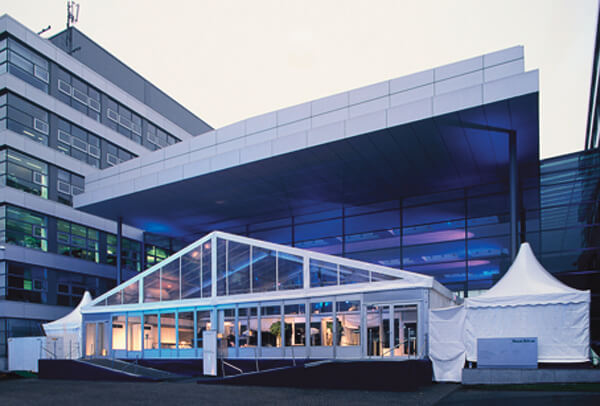Aerial view of Anchor Industries transparent clear span tent at city event