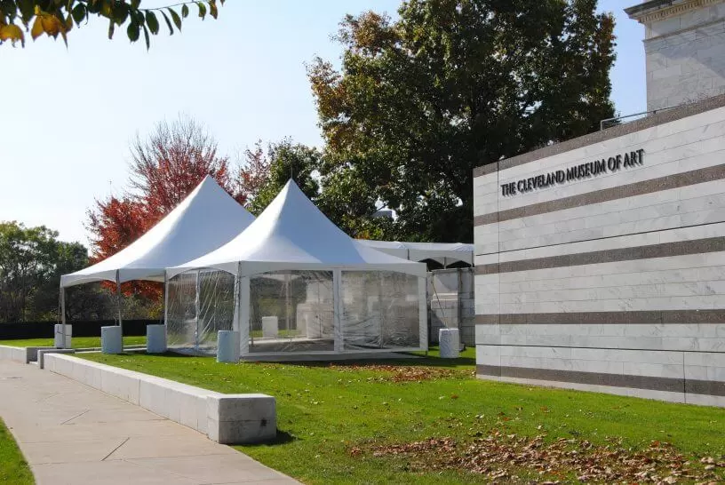 Elegant white frame tent outside The Cleveland Museum of Art, ideal for upscale events and outdoor gatherings. High-quality, durable event tent rental.