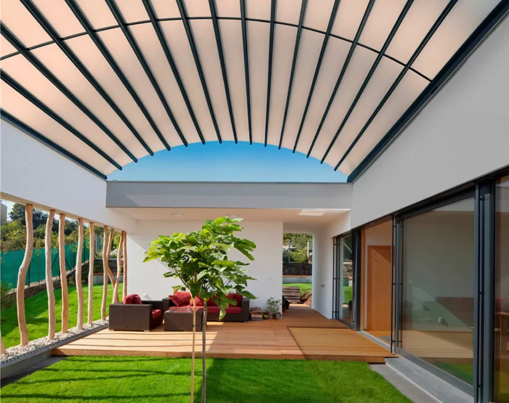 Contemporary patio with striped pergola roof.