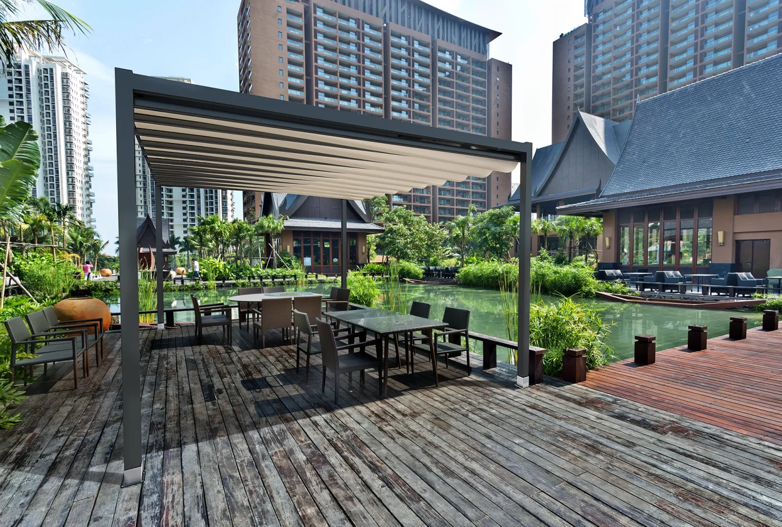 Modern rooftop deck with slatted pergola providing sun cover.