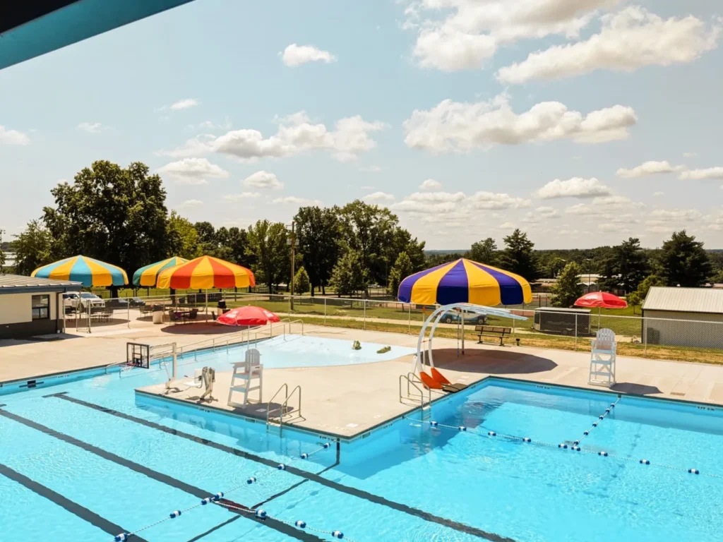 Yellow and red poolside umbrellas Anchor Industries resort installation