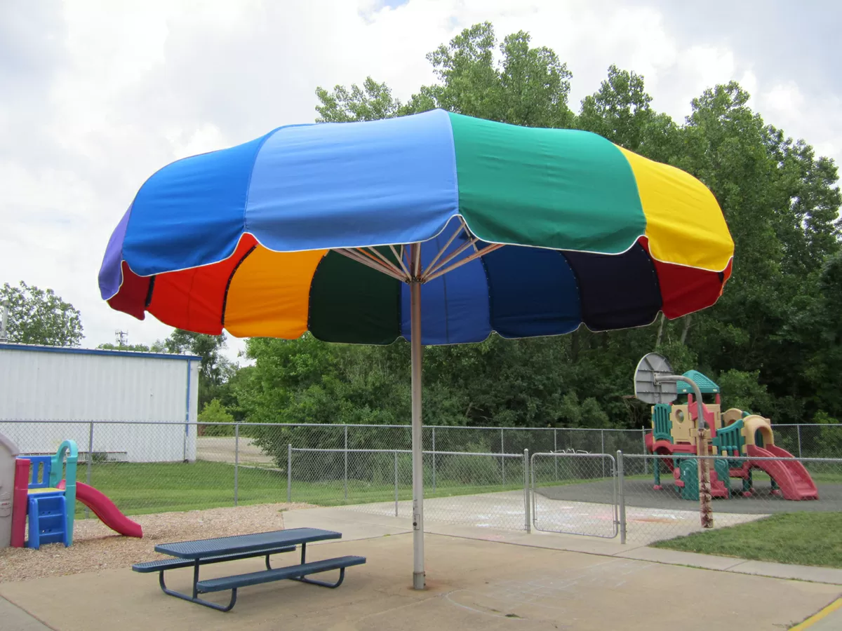 Anchor Industries multicolor umbrella shade structure at picnic area