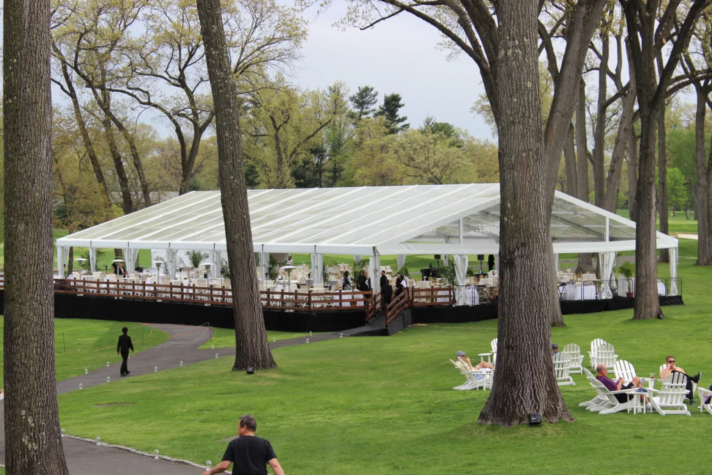 Large clear span tent installation at outdoor event Anchor Industries