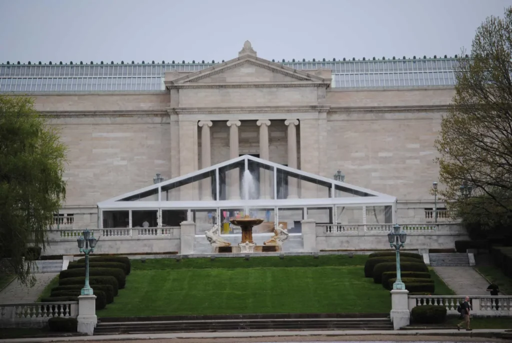 White clearspan tent installed at museum entrance for outdoor event
