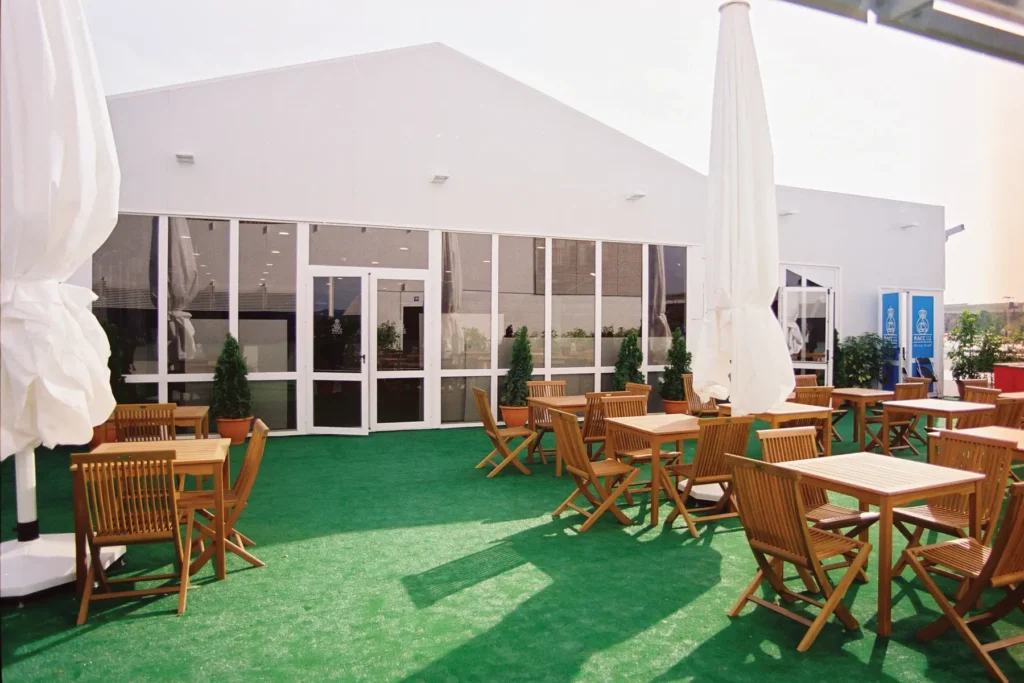 Anchor Industries clear span tent with glass doors at outdoor event