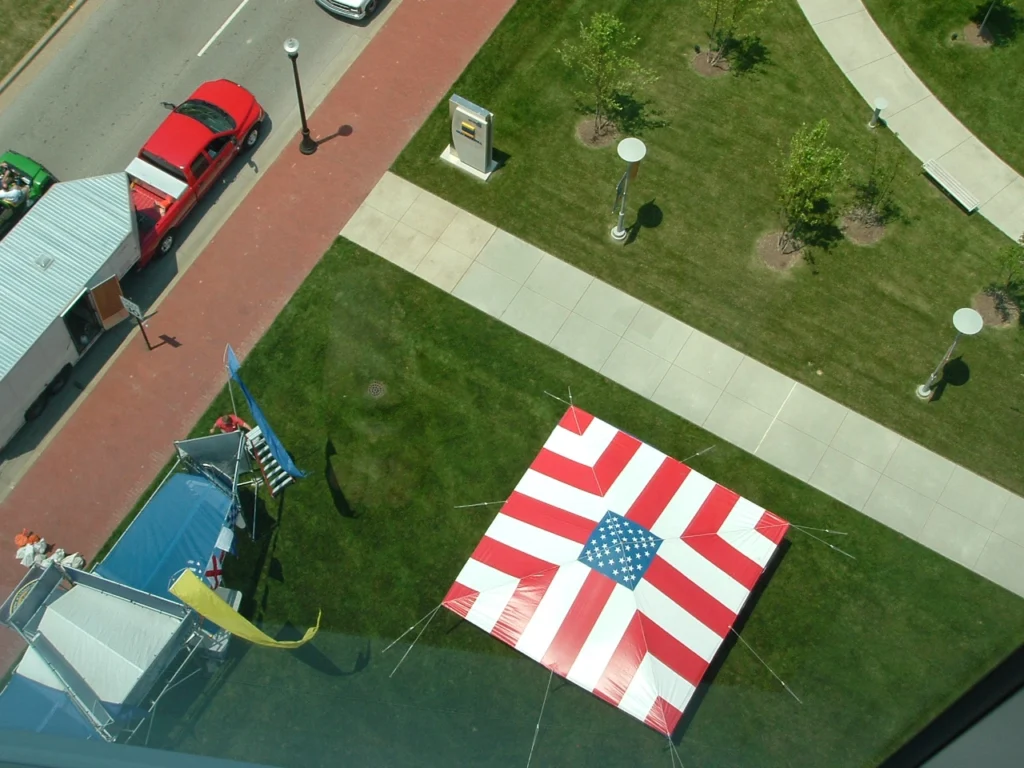 Aerial view of red and white striped Anchor Industries event tent