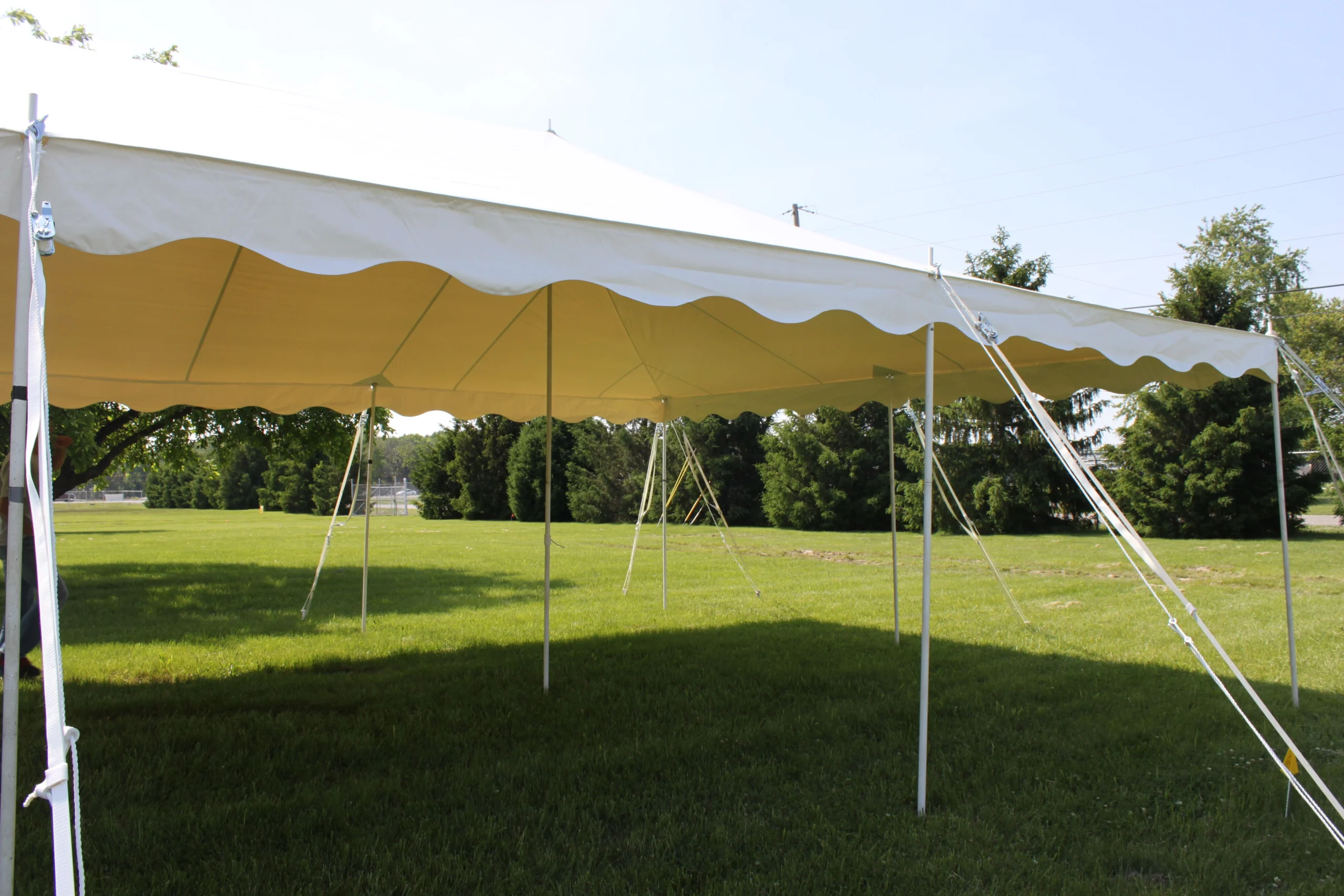 Yellow pole tent by Anchor Industries at outdoor event