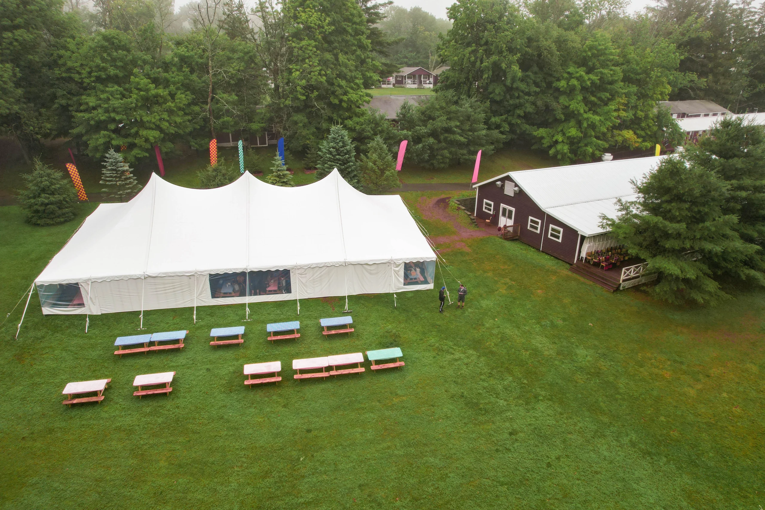 White Anchor Industries pole tent set up on grass for outdoor event
