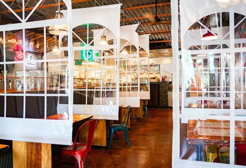 Clear partition systems by Anchor Industries in restaurant setting