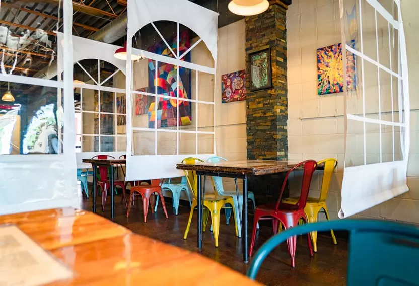 Anchor Industries clear divider panels in restaurant dining area