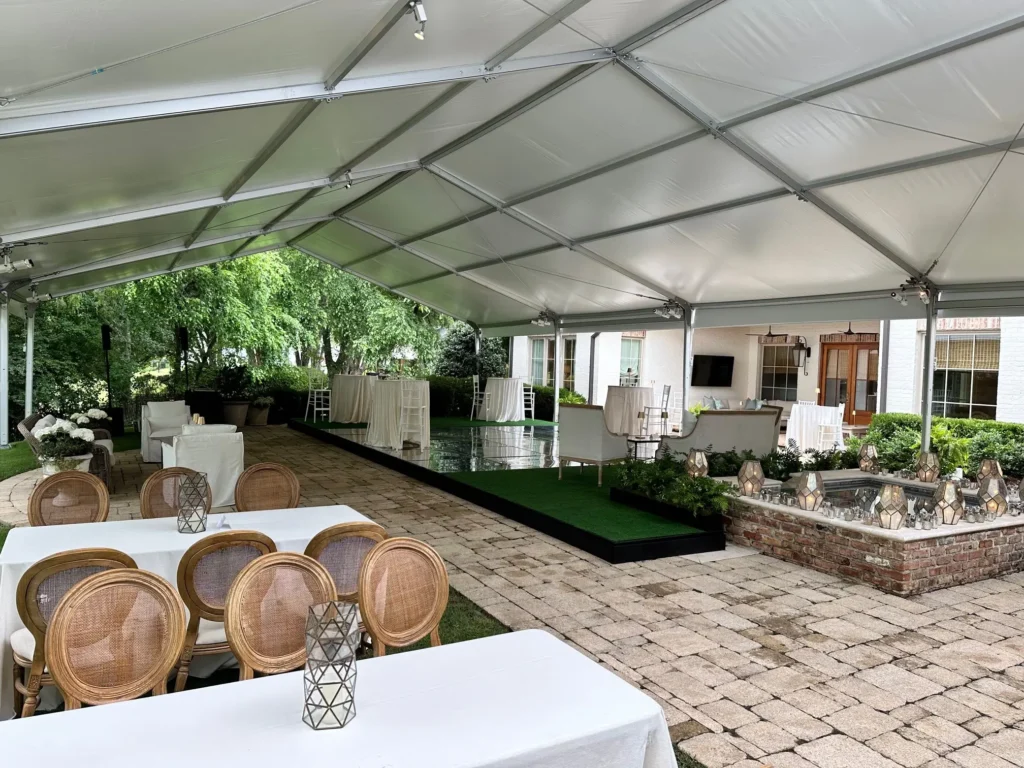 Anchor Industries clear span event tent with rustic dining setup